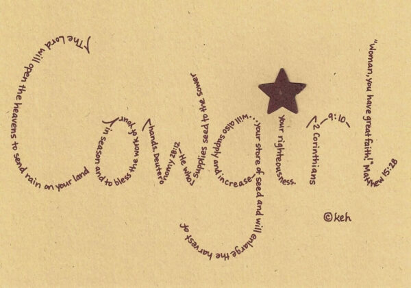 Cowgirl written in hand-printed Bible verses in burgundy ink on brown paper with rustic metal star embellishment