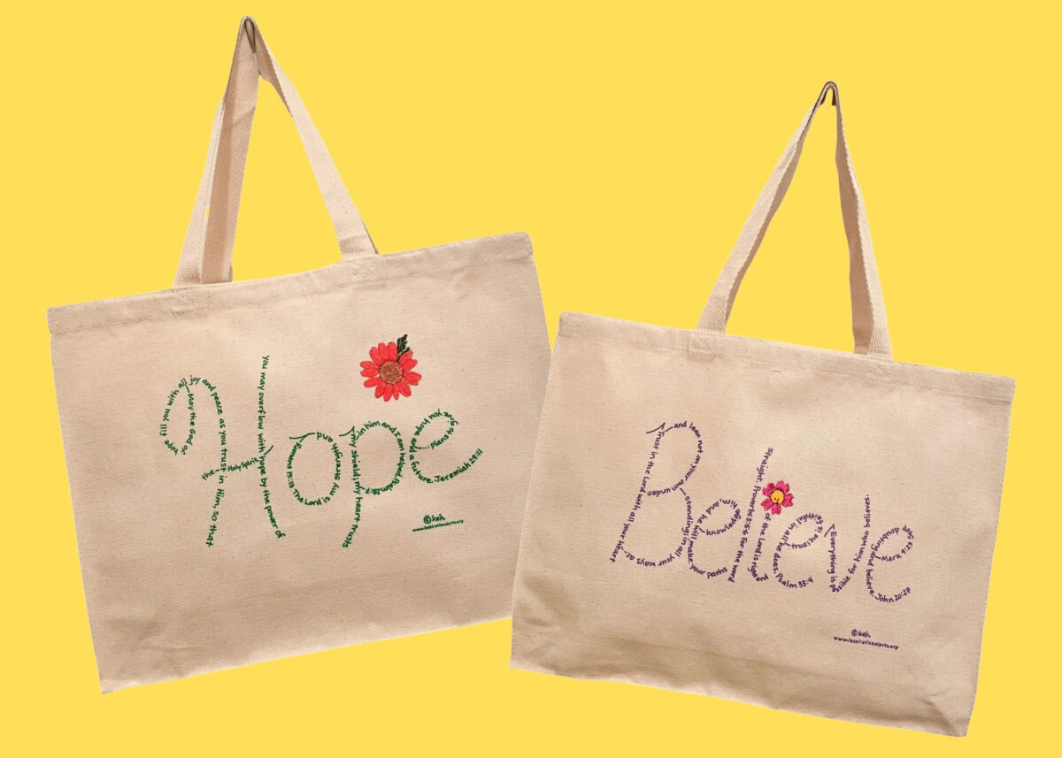 Hope and Believe tote bags on a yellow background
