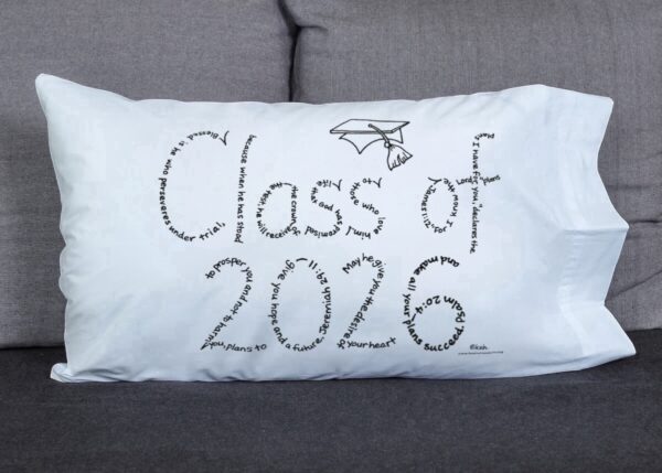 Class of 2026 written in hand-printed Bible verses in black ink on white pillowcase