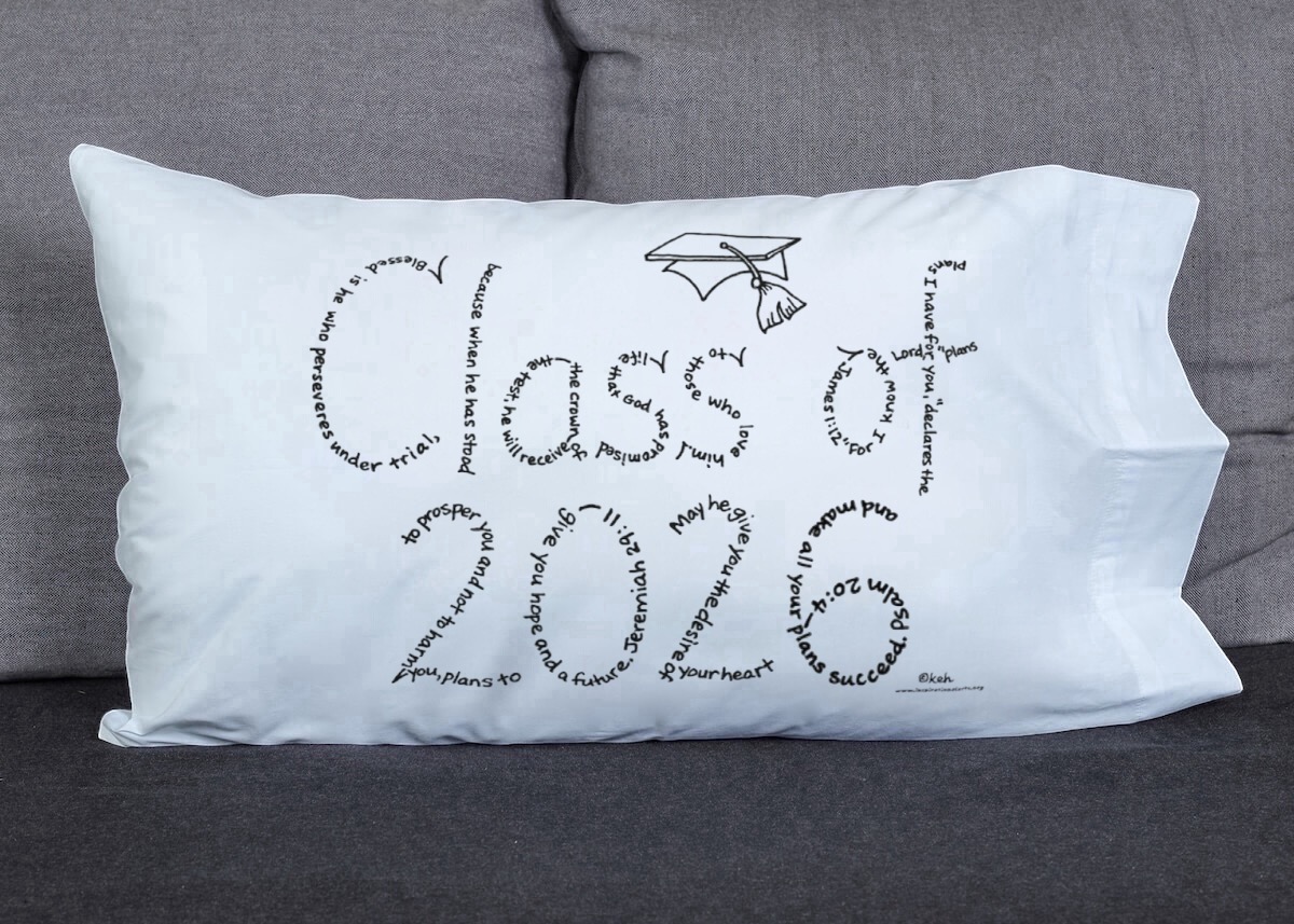 Class of 2026 written in hand-printed Bible verses in black ink on white pillowcase