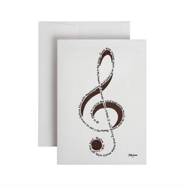 A treble clef created out of handprinted Bible verses in black ink on white note card