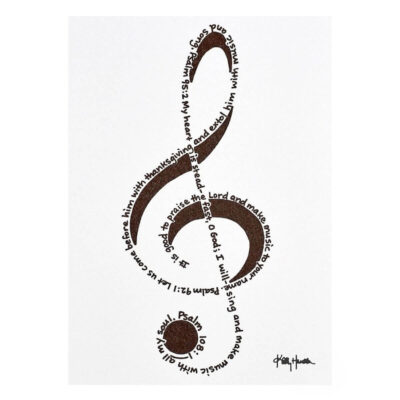 A treble clef created out of handprinted Bible verses in black ink on white note card