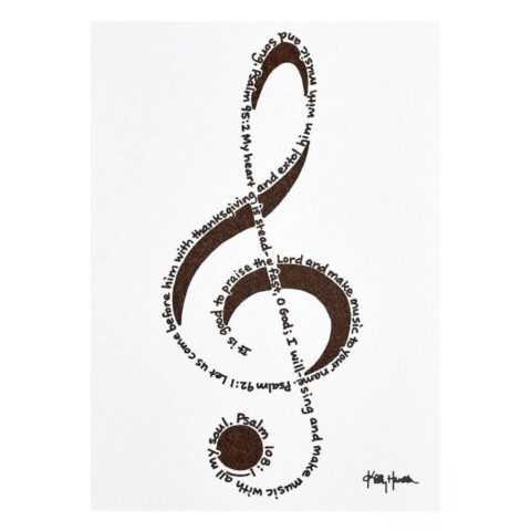 A treble clef created out of handprinted Bible verses in black ink on white note card